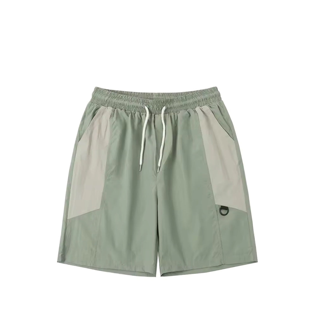 Neutral beige relaxed-fit nylon shorts with contrast panels, elastic waist, and drawstring closure