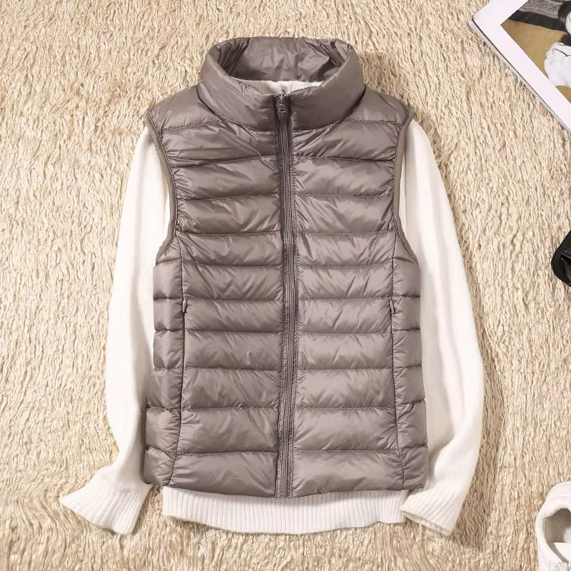 Women's cropped sleeveless light down puffer vest, slim fit with quilted panels for lightweight warmth