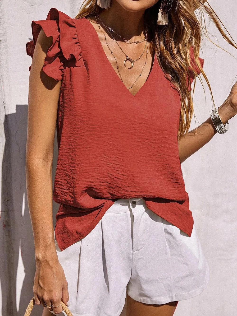 Lightweight V-neck ruffle sleeve summer top in soft feminine hues for effortless warm-weather style