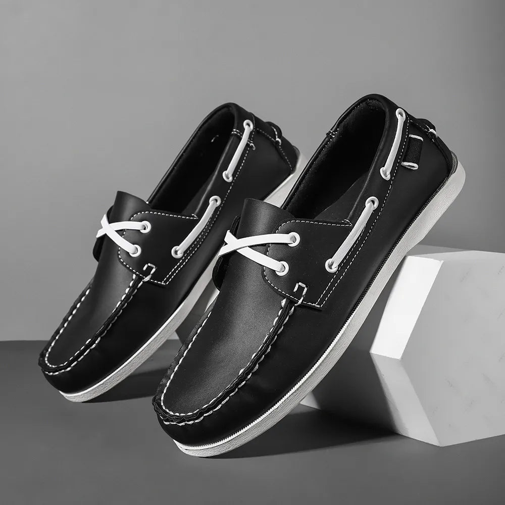 Men's navy two-tone slip-on boat shoes with synthetic leather upper and cushioned EVA foam sole