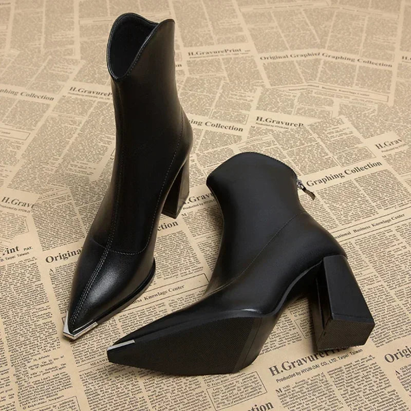 Dark faux leather women's Chelsea ankle boot with chrome toe tip and sleek silhouette