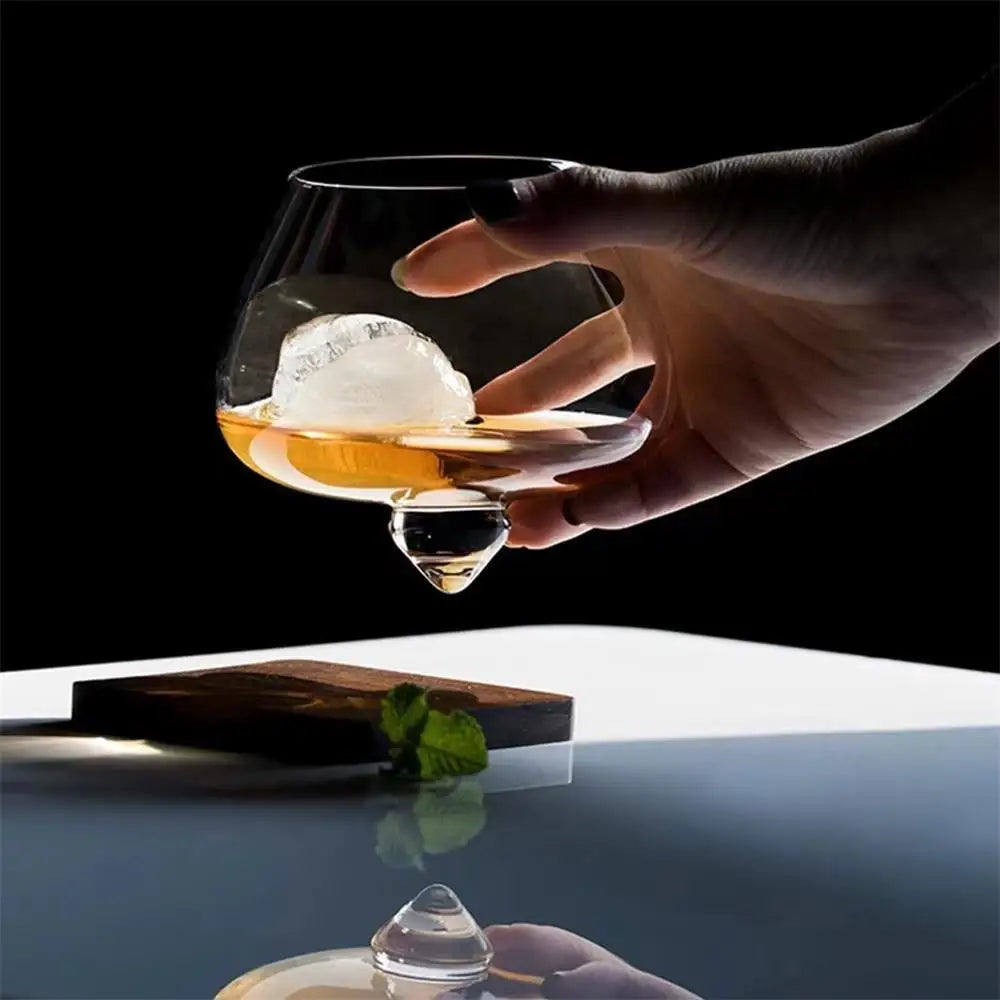 Dane rotating whiskey glass with spinning base design for enhanced swirl and visual flair
