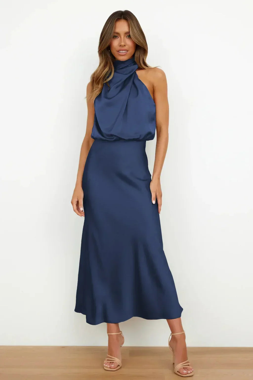 Sleek satin halter evening dress with flowing silhouette in elegant cut for formal occasions