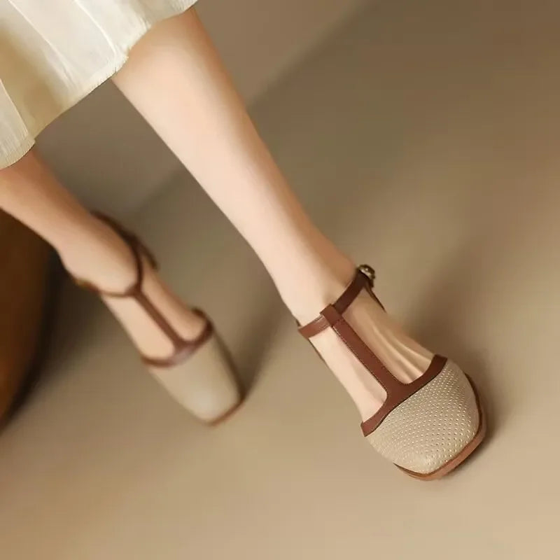 Women's black perforated T-strap block heel pumps with square toe and contrasting tan strap