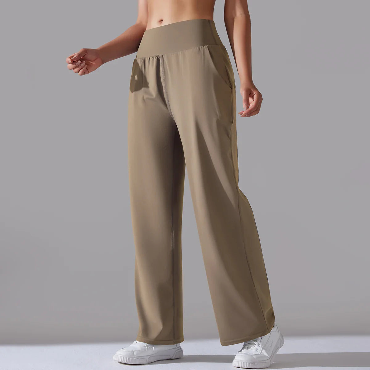 Black wide-leg leggings with silky drape, sculpting waistband, and effortless relaxed silhouette