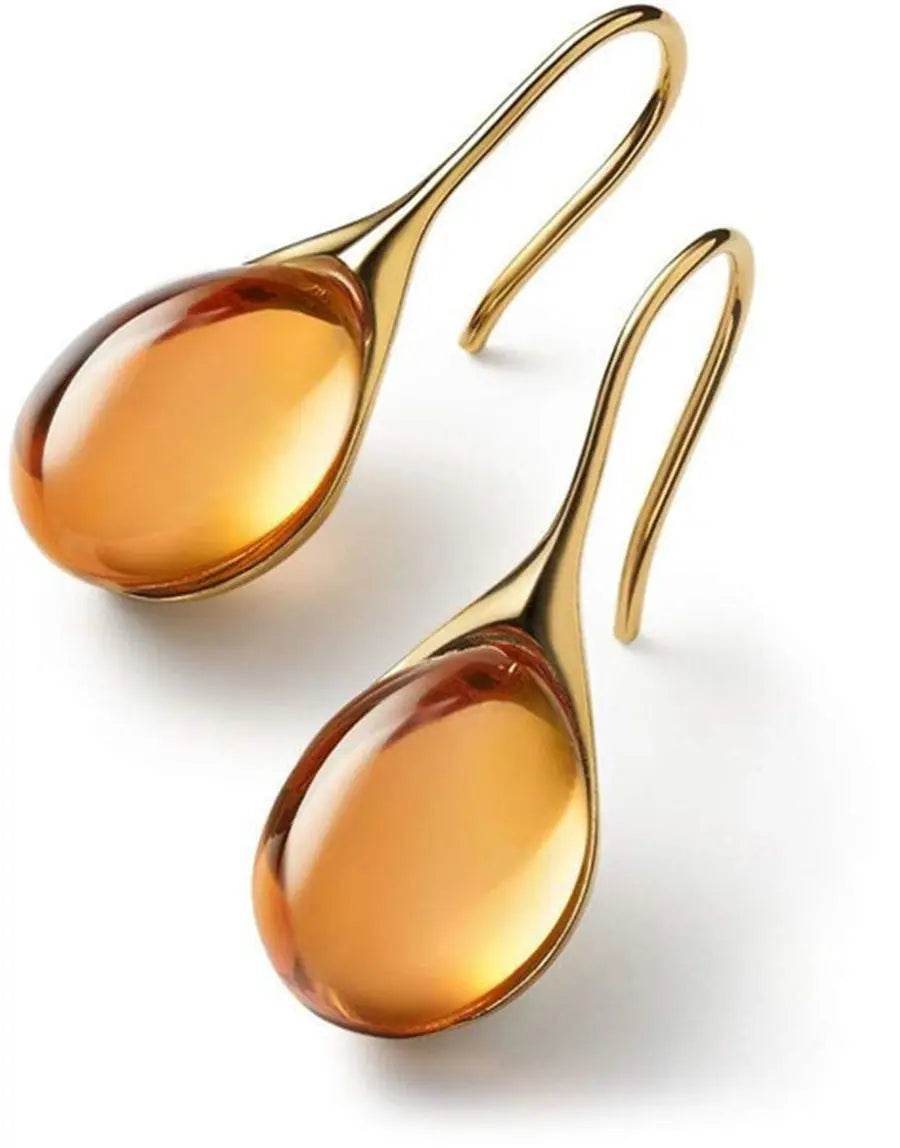 Denise gold-plated teardrop earrings with amber resin centerpiece, minimalist elegant design
