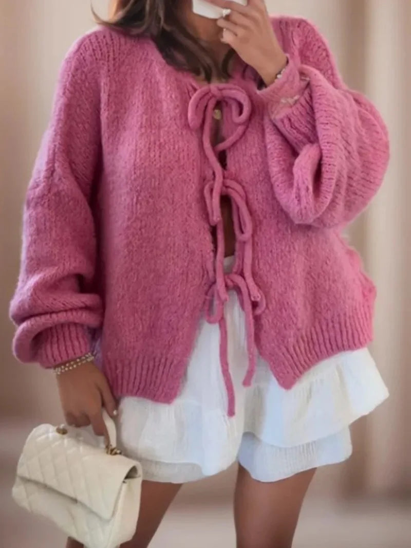 Women's chunky knit cardigan in cozy winter style with knotted front tie detail for flattering fit