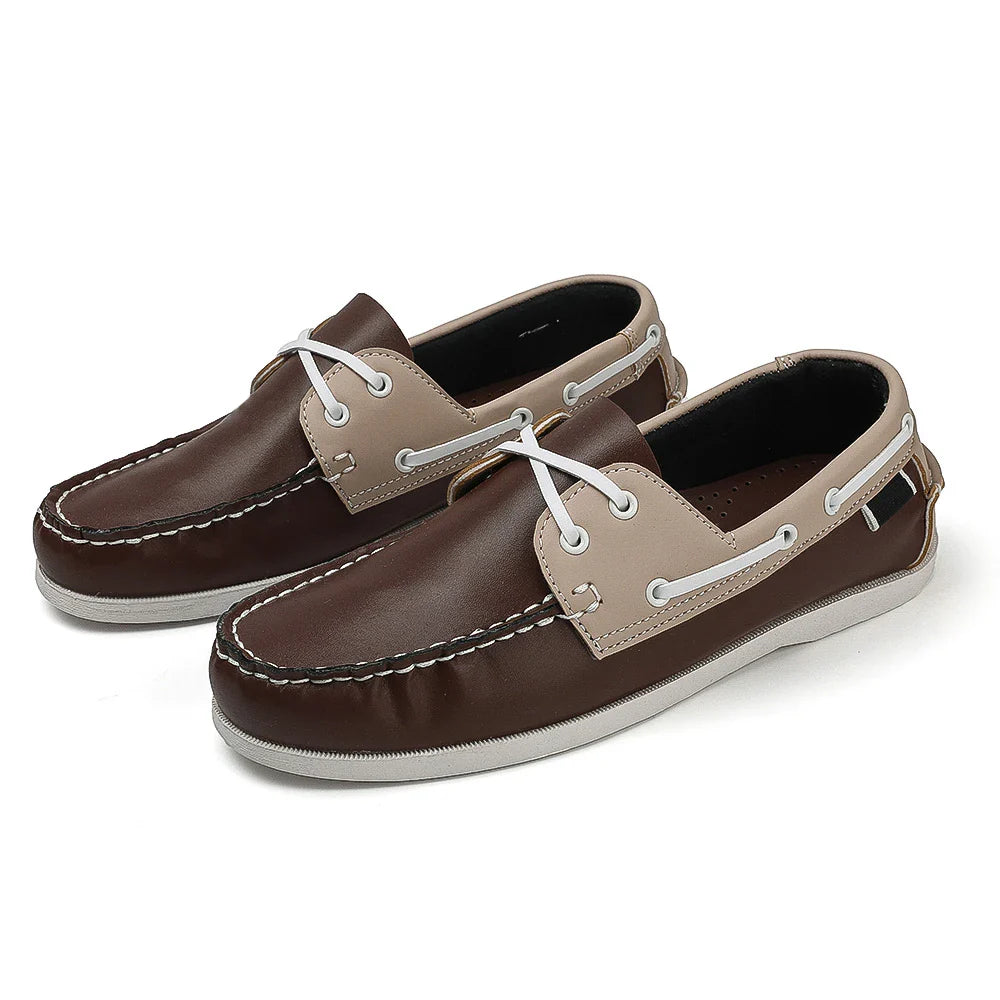 Men's two-tone navy slip-on boat shoes with synthetic leather upper and cushioned EVA foam sole