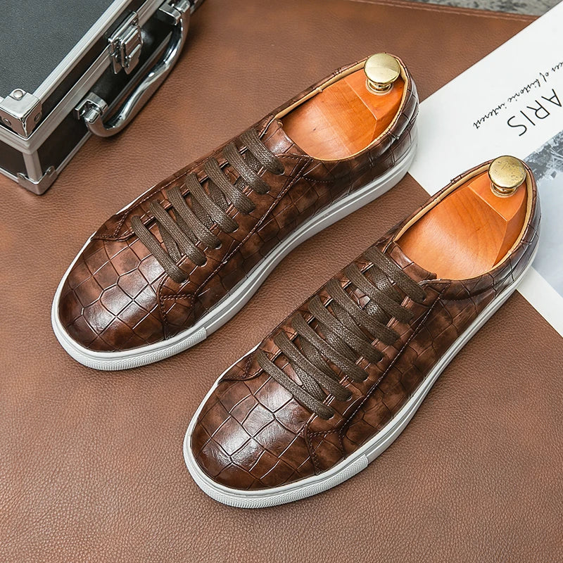 White low-top sneaker with embossed alligator texture, synthetic leather upper and cushioned rubber outsole