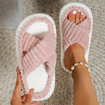 Women's plush cross-band slide slippers in cozy fabric with soft cushioned footbed for all-day comfort