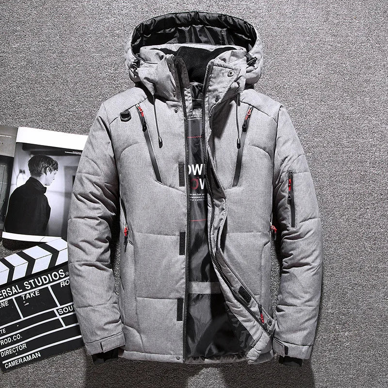 Men's black puffer jacket with detachable hood, storm flap, clean silhouette winter outerwear