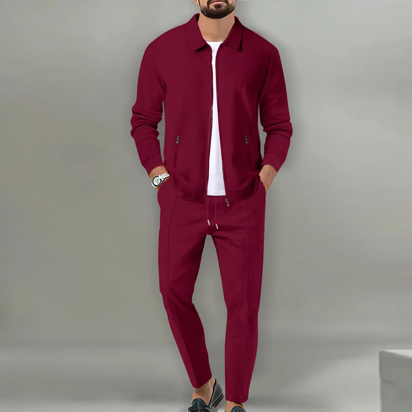 Men's two-piece polo jacket shirt and matching drawstring pants set in coordinated everyday style