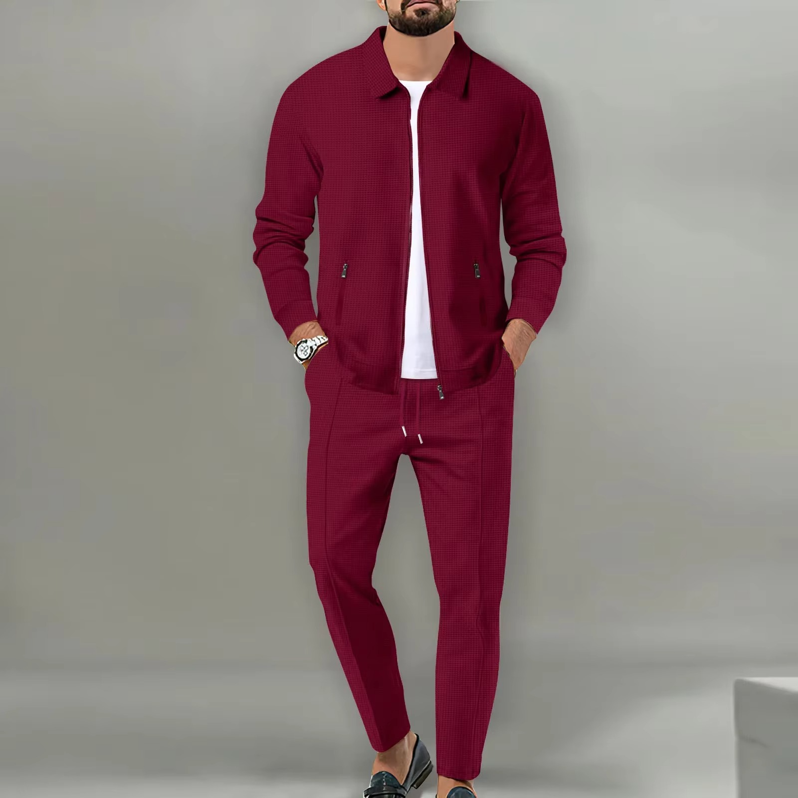 Men's two-piece polo jacket shirt and matching drawstring pants set in coordinated everyday style