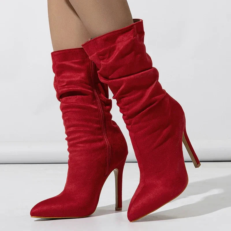 Black velvet stiletto boot with plush finish, sleek heel, and relaxed shaft for elevated evenings