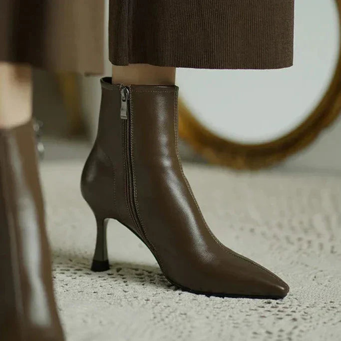 Sleek black ankle boots with slimming sculpted profile for confident everyday wear