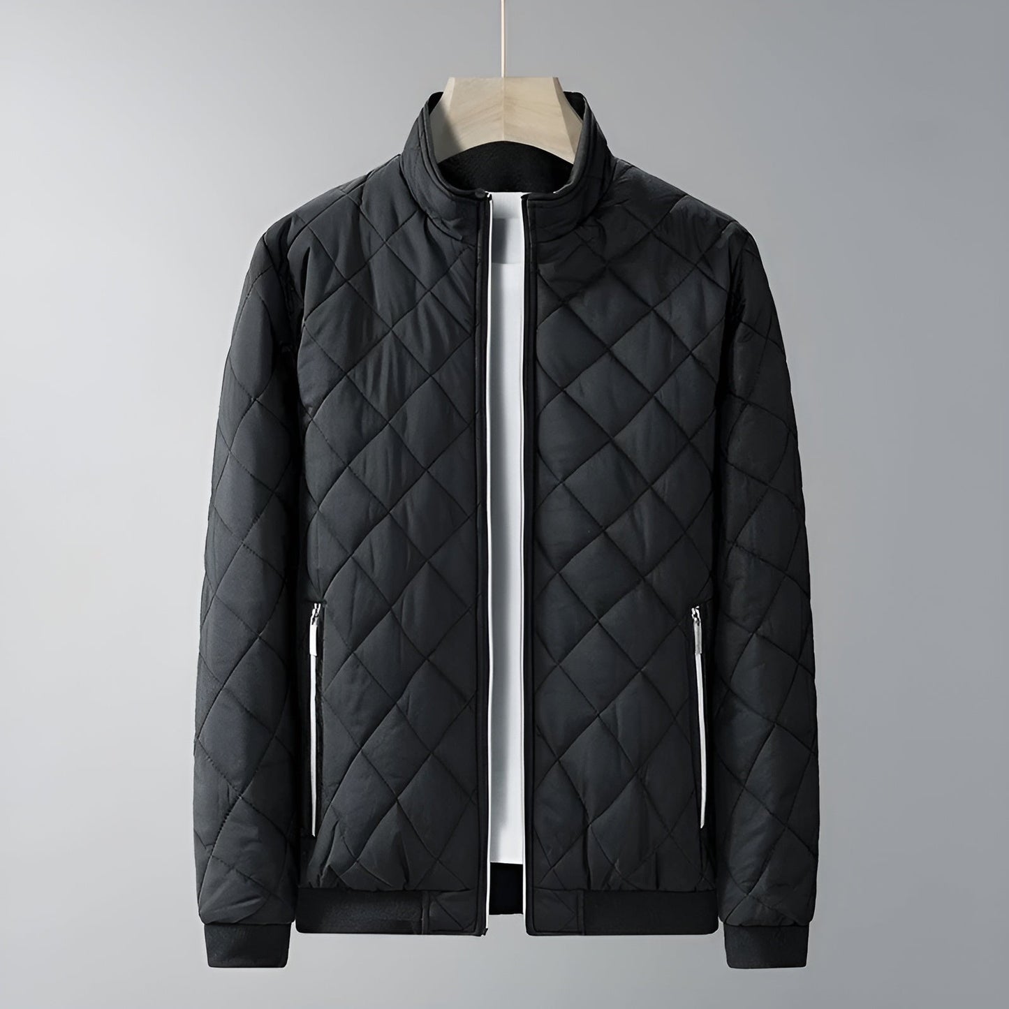 Lightweight quilted thermal jacket with high stub collar, fleece lining, and chrome zipper accent