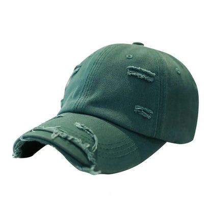 Vintage distressed cotton baseball hat with extended brim and rugged ripped detailing in multiple colors