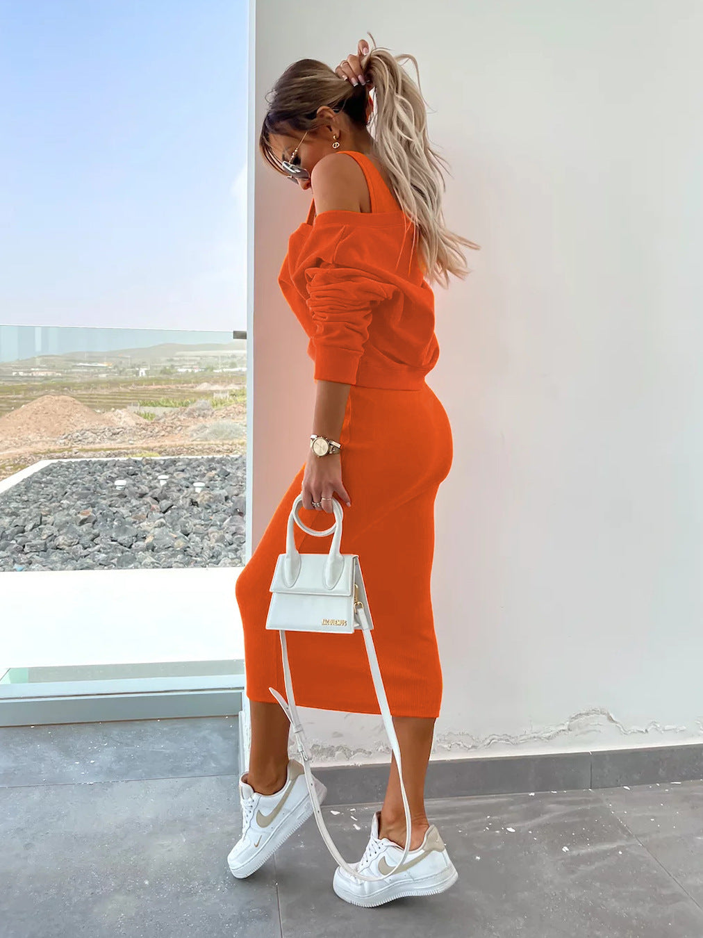Women's sleeveless ribbed midi dress in elegant V-neck stretch fit, polished day-to-night style
