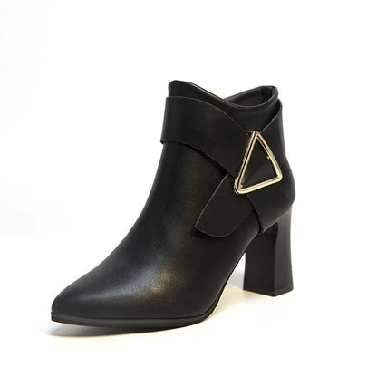Black high heel boots with distinctive triangle buckle detail, sleek pointed-toe silhouette for women