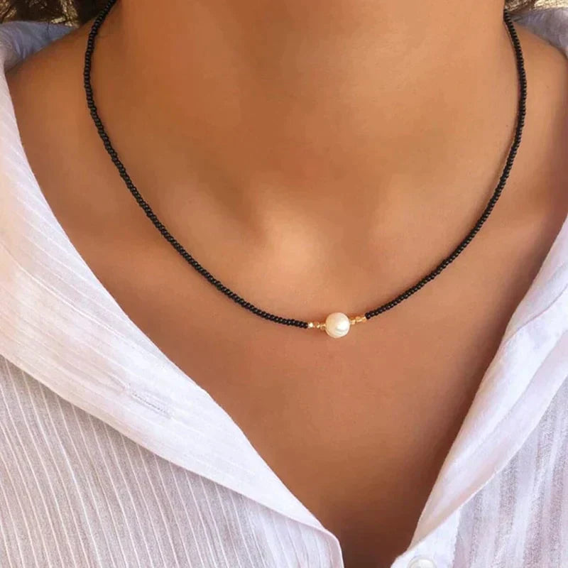 Minimalist pearl beaded choker necklace with single faux pearl centerpiece, choker-length fit