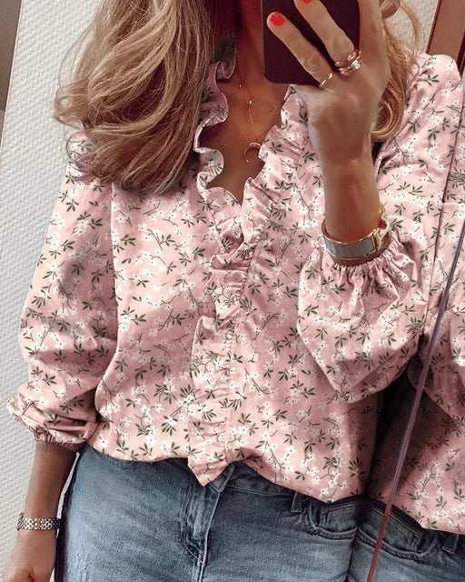 Feminine white blouse with ruffled neckline and elegant pleated balloon sleeves