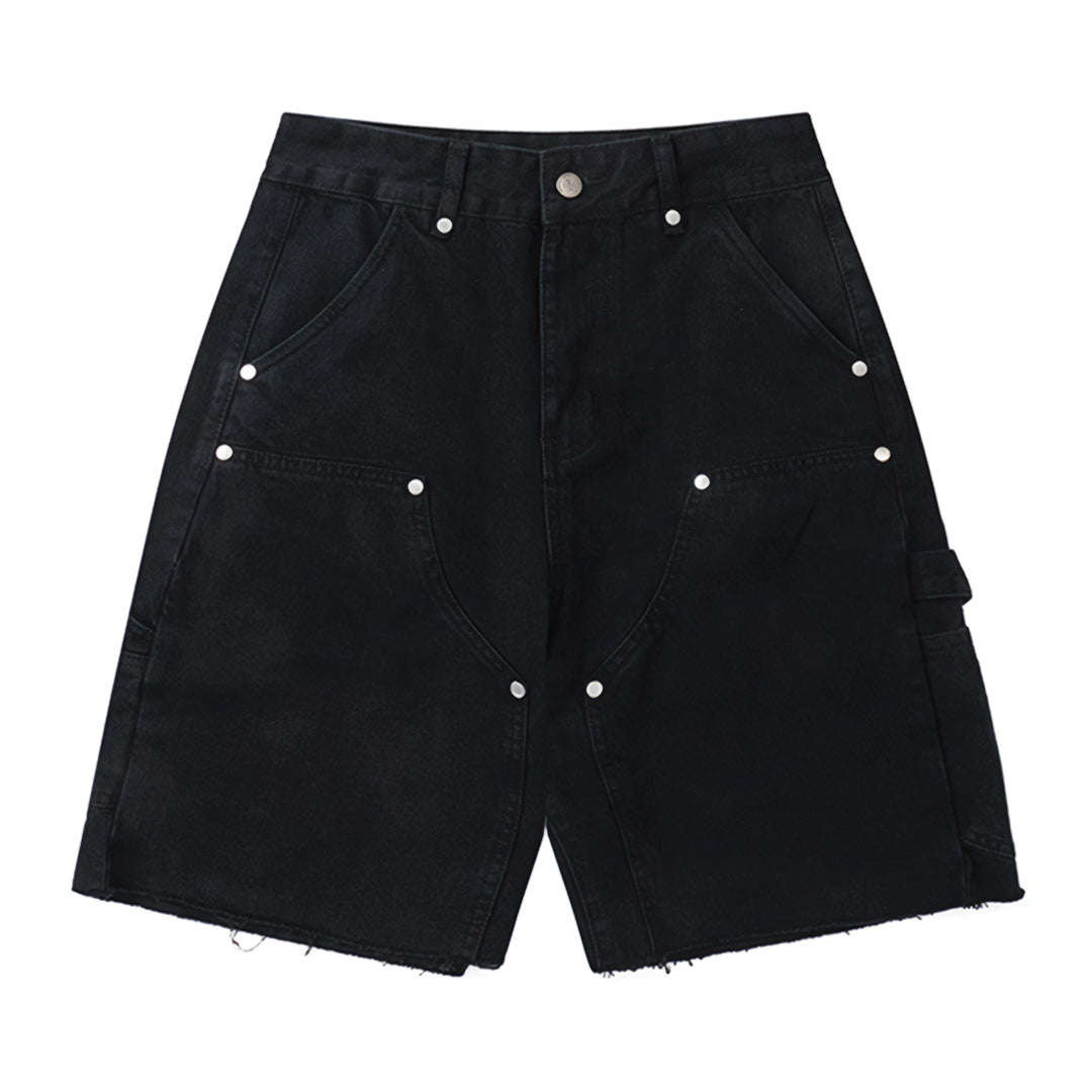 Sun-washed blue denim carpenter shorts with riveted pockets and raw-cut hem, knee length
