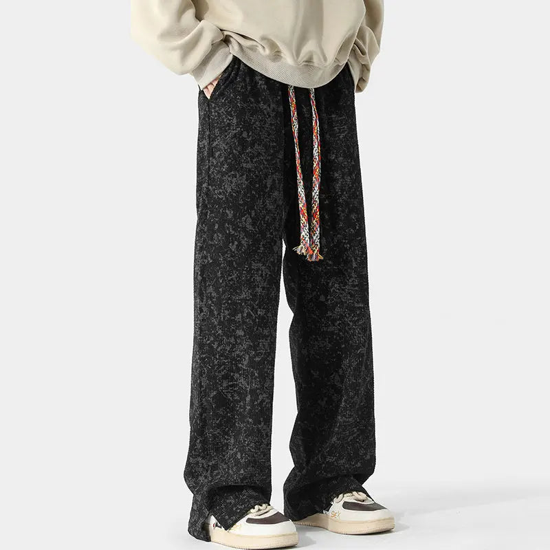 Vintage acid-wash wide-leg sweatpants in muted tones with split-hem detail and braided drawstring