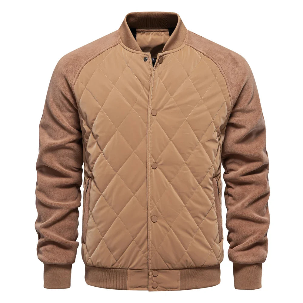Navy quilted bomber jacket with suede-texture sleeves, ribbed trim, and diamond-quilted front panel