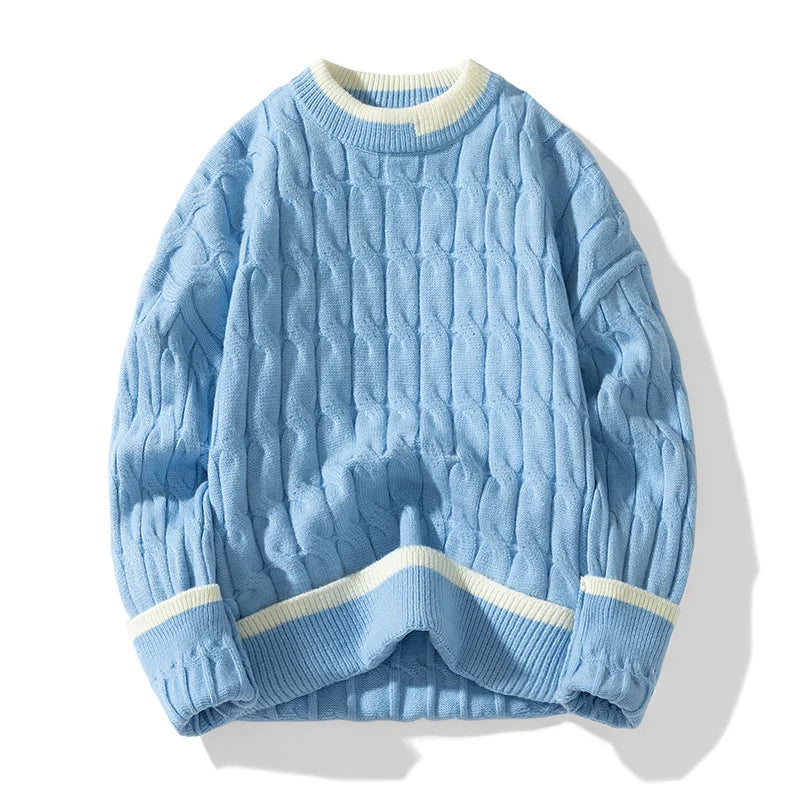 Ivory cable knit pullover sweater with patchwork design, relaxed fit, and ribbed edges