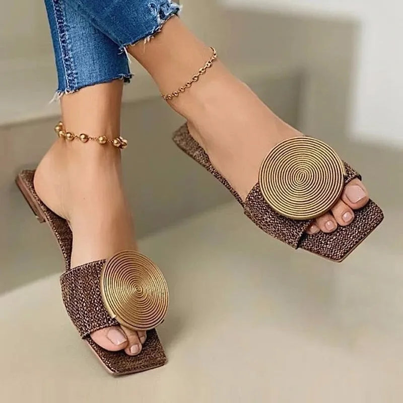 Women's woven sandals with intricate thread detailing, elegant and supportive everyday style