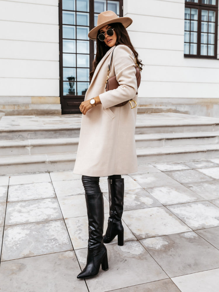 Women's double-breasted longline coat with structured silhouette, warm layering, versatile styling essential