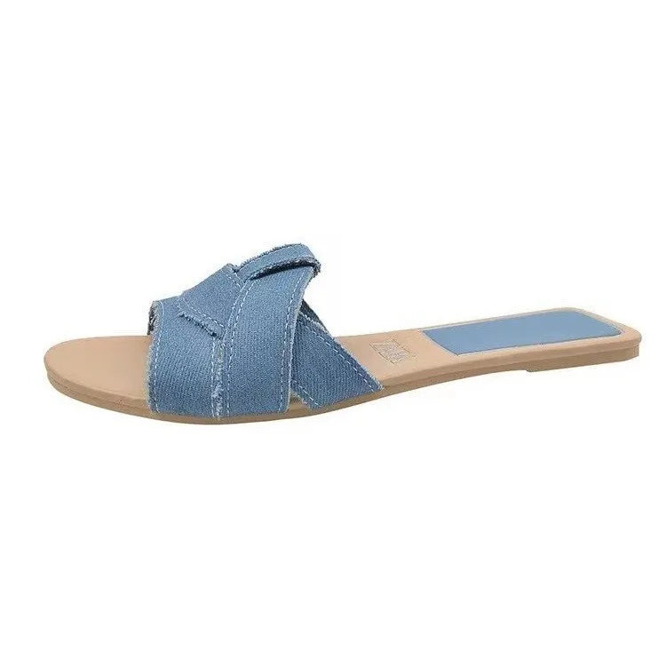 Women's cushioned flat slides with smooth minimalist straps and lightweight sole for everyday comfort