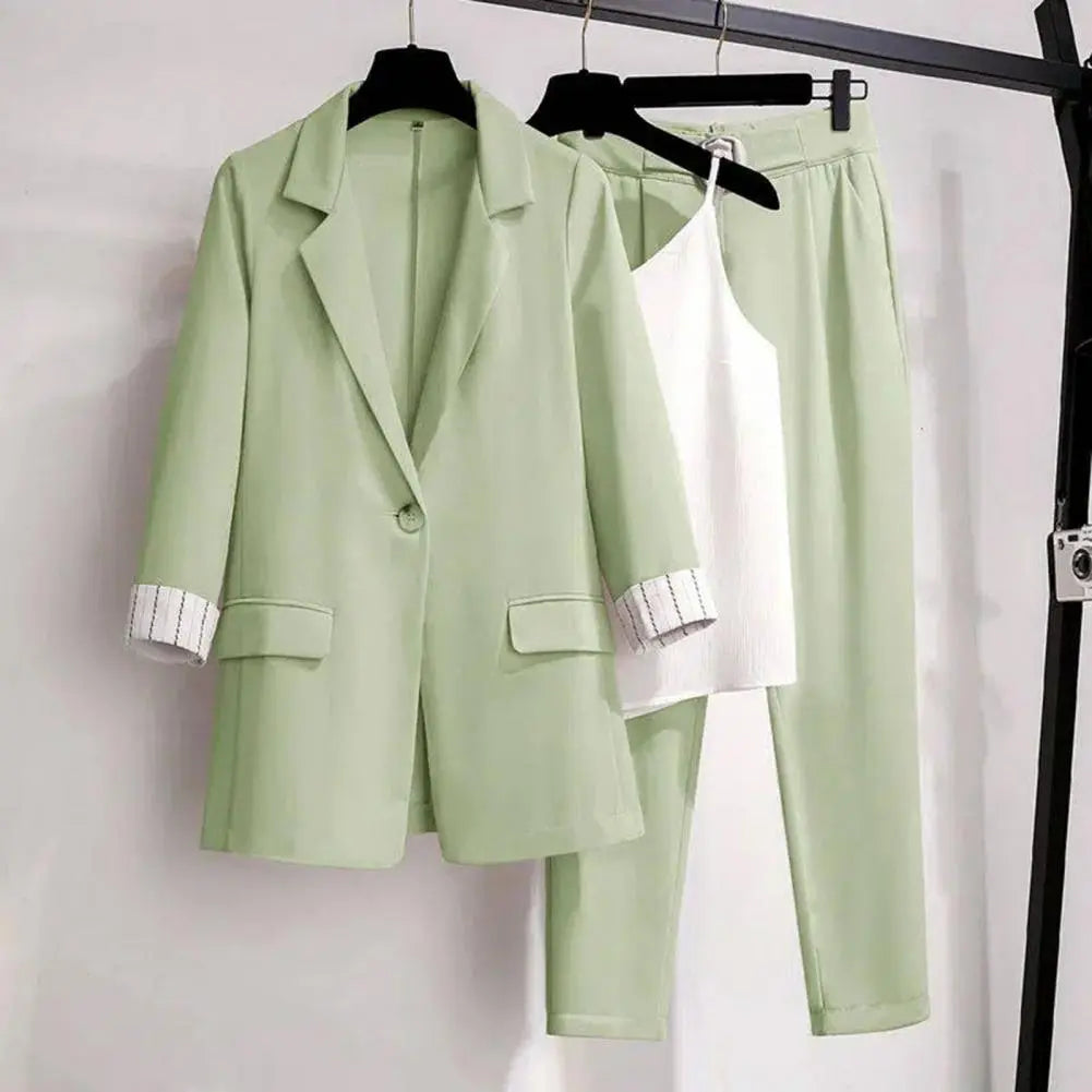 Women's chic coordinated blazer pants and top three-piece set tailored sleeveless sophisticated workwear