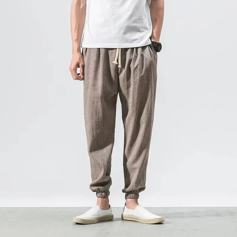 Men's relaxed fit cotton linen harem pants with cuffed ankles in neutral minimalist style