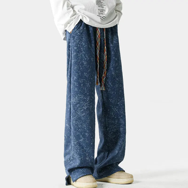 Vintage acid-wash wide-leg sweatpants with split-hem, braided drawstring, and elastic waist in relaxed streetwear fit
