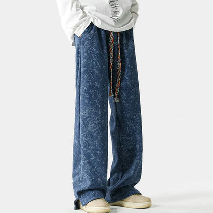 Vintage acid-wash wide-leg sweatpants with split-hem, braided drawstring, and elastic waist in relaxed streetwear fit