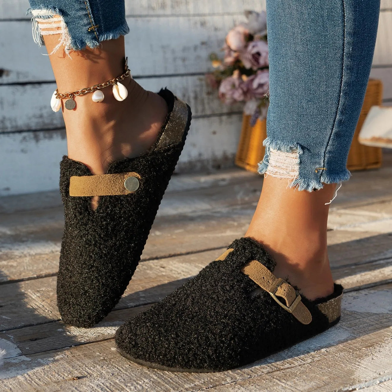 Cozy slip-on sherpa lounge slippers with plush lining, buckle accent, and platform sole