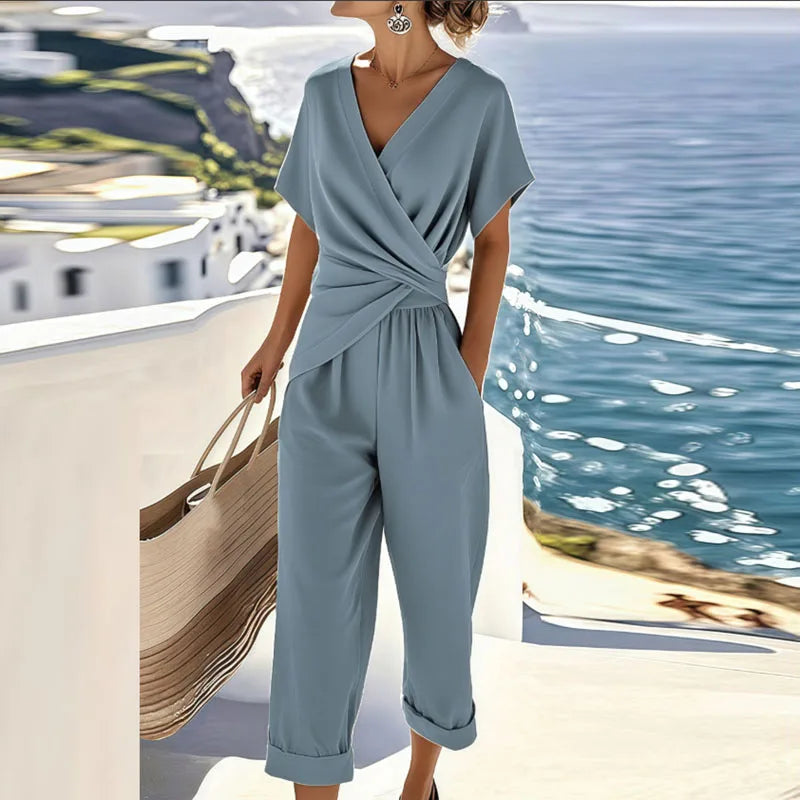 Elegant two-piece wrap-front top and tailored cropped trousers set with feminine silhouette