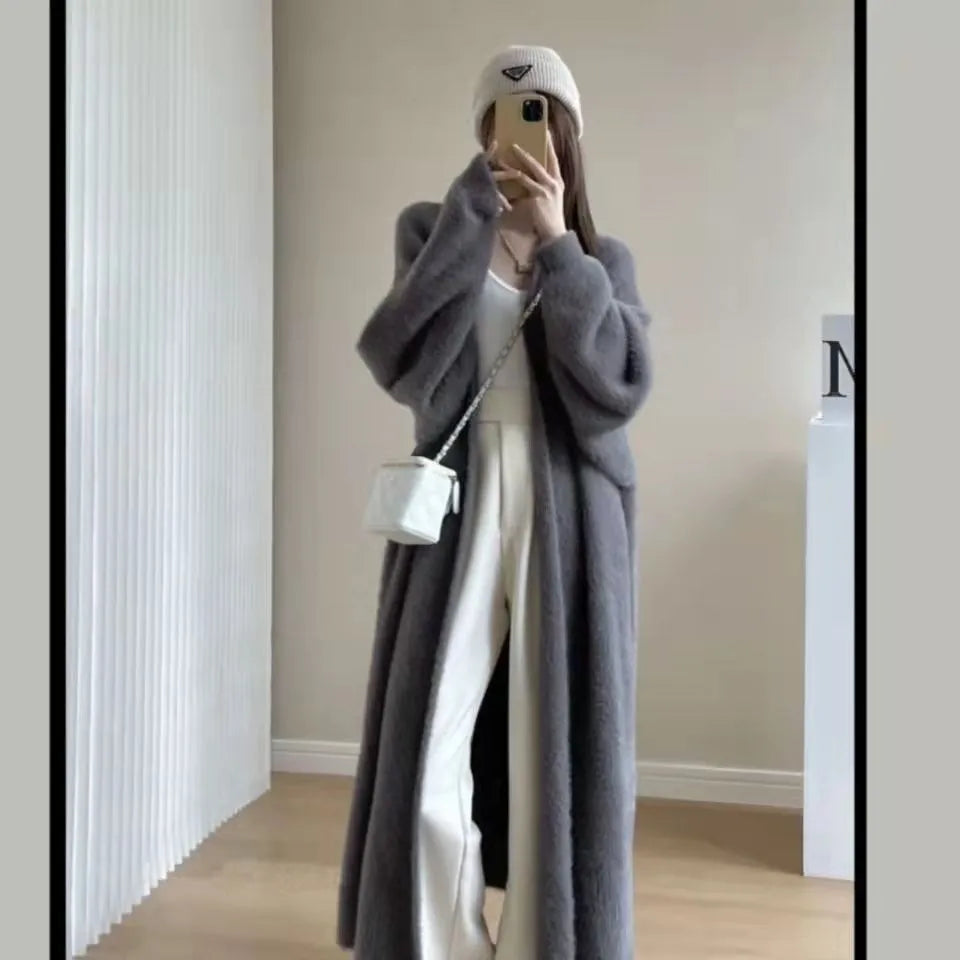 Meridian longline cashmere-blend coat in neutral tone with fluid silhouette and ribbed trim
