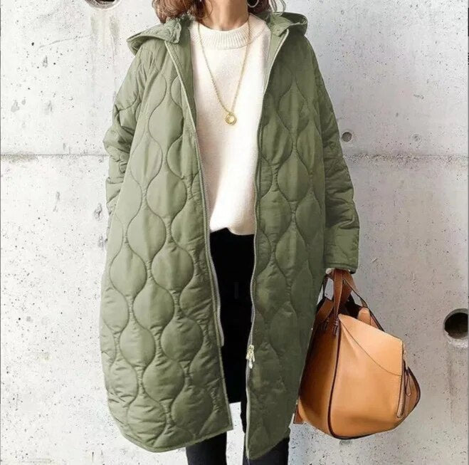 Women's oversized quilted parka coat, hooded knee-length design with bubble texture detailing