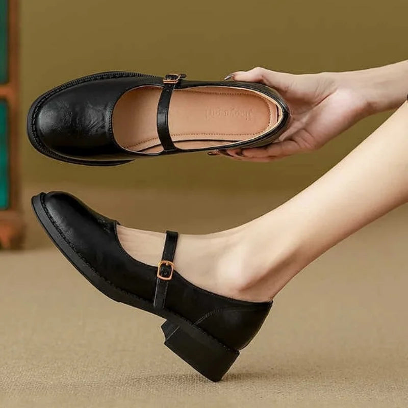 Women's black leather Mary Jane shoes low block heel single strap polished timeless silhouette