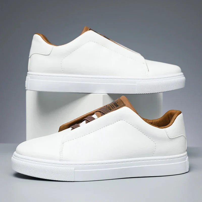 Navy faux leather low-top slip-on sneaker with thick white sole, clean silhouette for men
