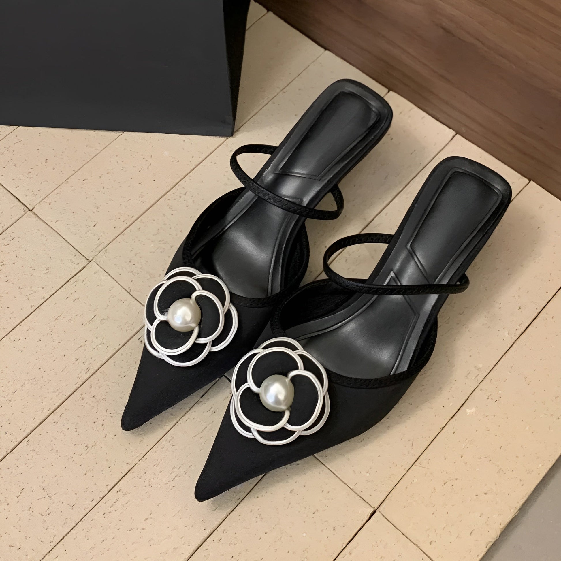 Elise Étoile women's mule pump with sculpted floral vamp detail and pearl accent centerpiece