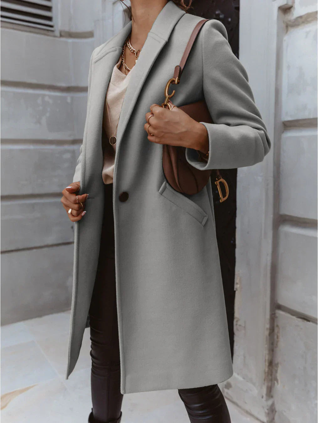 Women's double-breasted longline coat structured silhouette versatile layering essential for modern style
