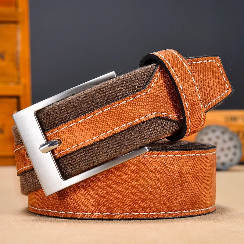 Men's rugged denim belt with full-grain leather reinforcement and solid metal buckle in classic blue