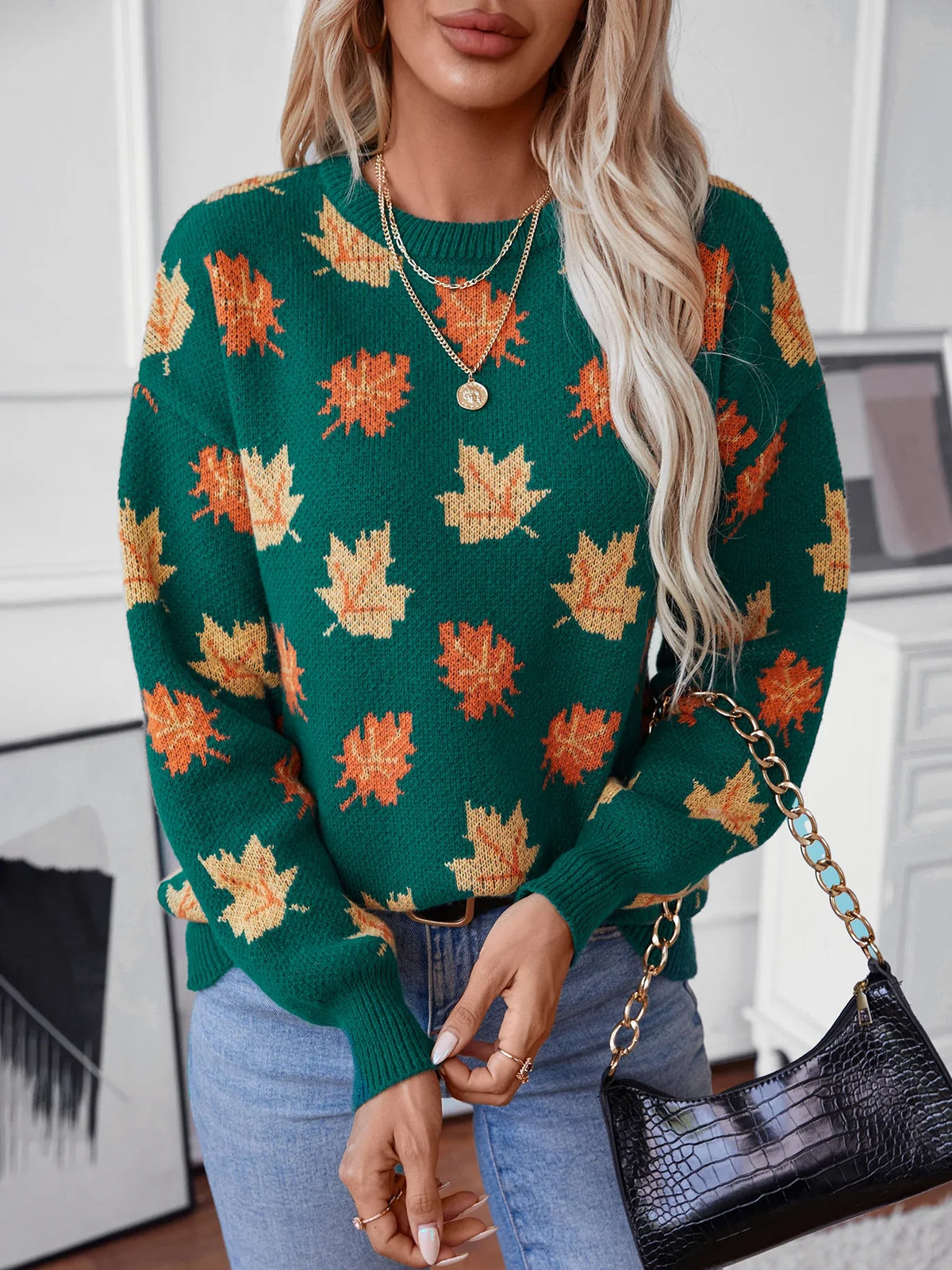 Cozy beige knitted pullover sweater with vibrant autumn leaves pattern, relaxed fit, woven knit fabric
