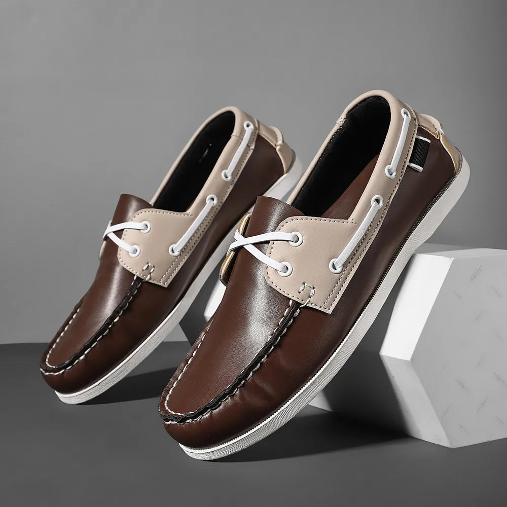 Men's two-tone navy slip-on boat shoes with synthetic leather upper and cushioned EVA foam sole