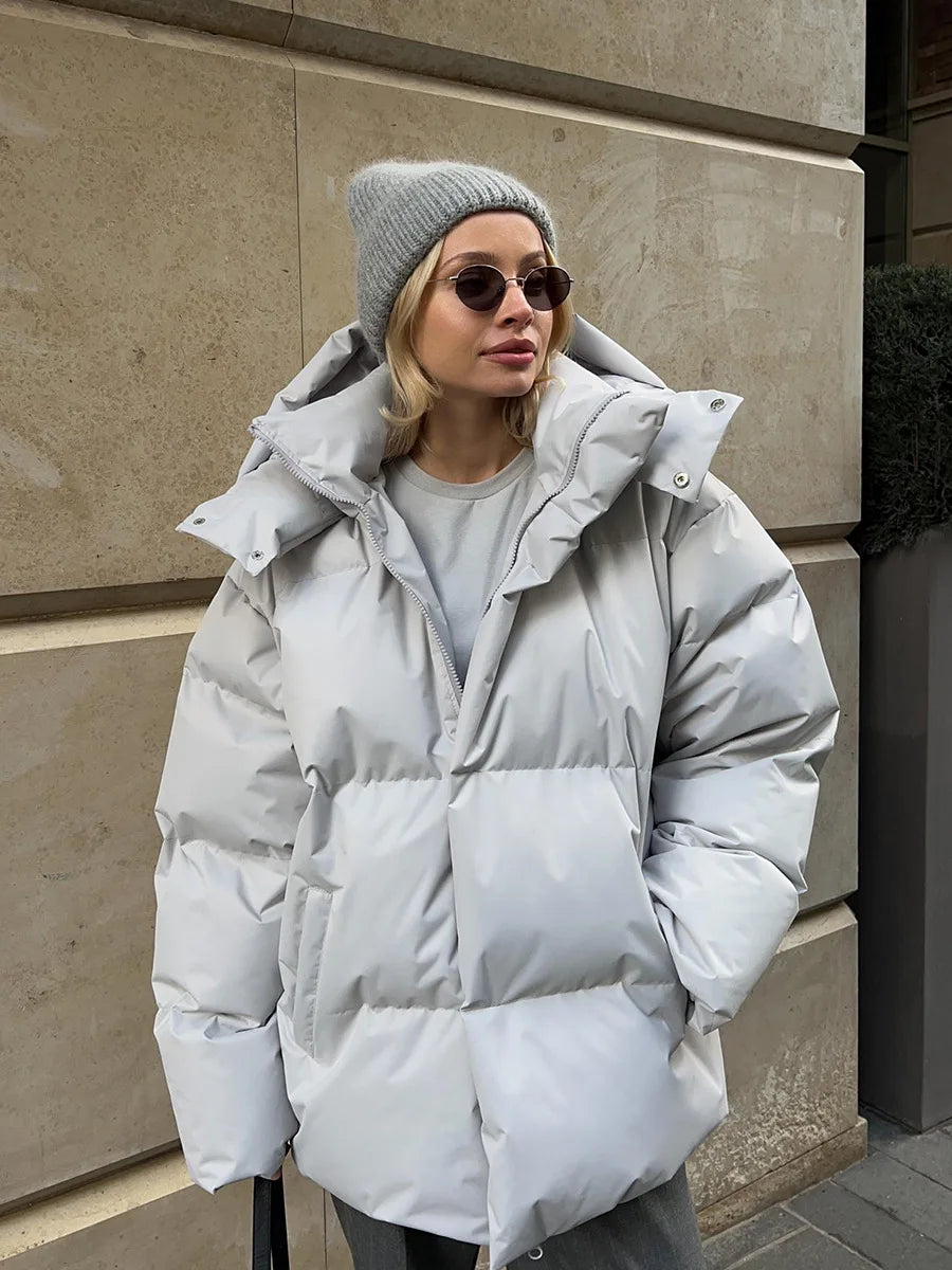 Oversized cotton puffer jacket with hood in cozy winter style, loose fit casual outerwear
