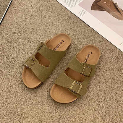 Women's cushioned slip-on buckle sandals in neutral tone with contoured footbed and elegant slide silhouette