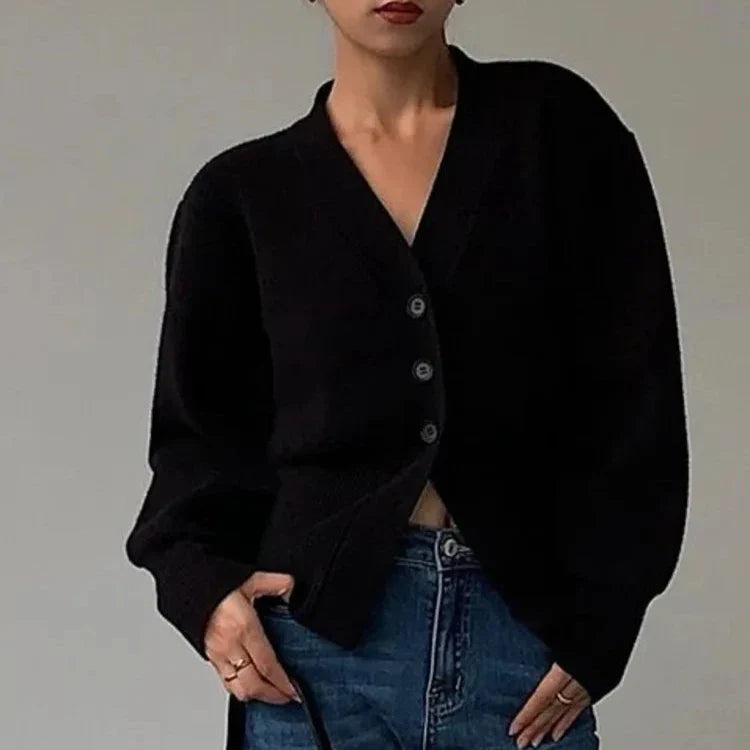 Cream ribbed knit sweater with relaxed sleeves, tailored body fit, and soft breathable fabric